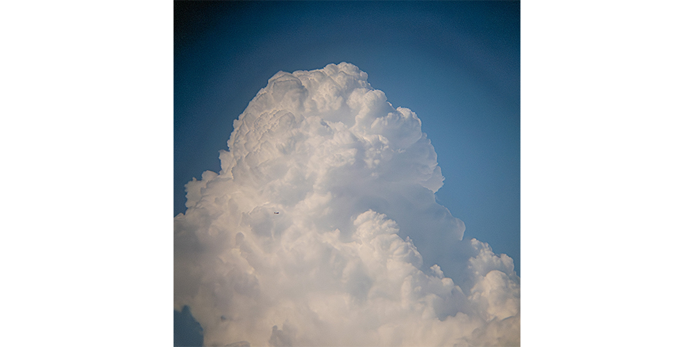 Cumulus Cloud with an Airplane